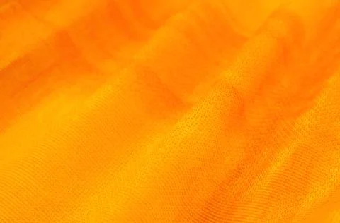Texture, background, pattern. Orange Silk Fabric for Drapery Abstract Stock Photos