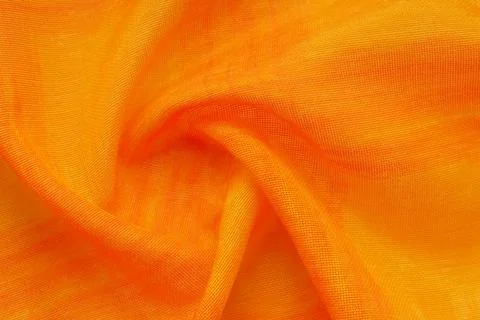 Texture, background, pattern. Orange Silk Fabric for Drapery Abstract Foto stock