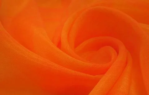 Texture, background, pattern. Orange Silk Fabric for Drapery Abstract Stock Photos