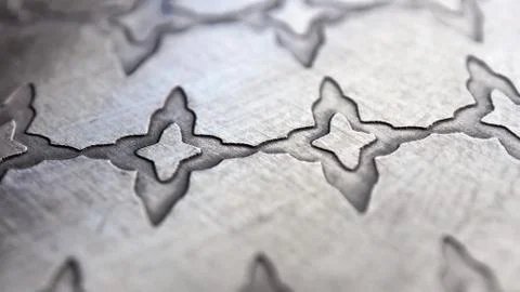 Texture, background of a pattern of a silver platter in closeup in gray Stock Photos