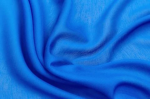 Texture, background, pattern. Texture of blue silk or cotton or wool fabric.  Stock Photos