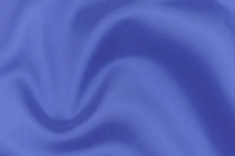 Texture, background, pattern. Texture of blue silk or cotton or wool fabric.  Stock Photos