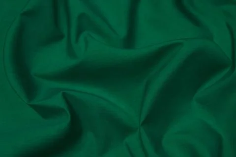 Texture, background, pattern. Texture of green silk fabric. Beautiful emerald Stock Photos