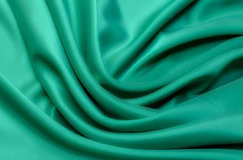Texture, background, pattern. Texture of green silk or cotton or wool fabric. Stock Photos