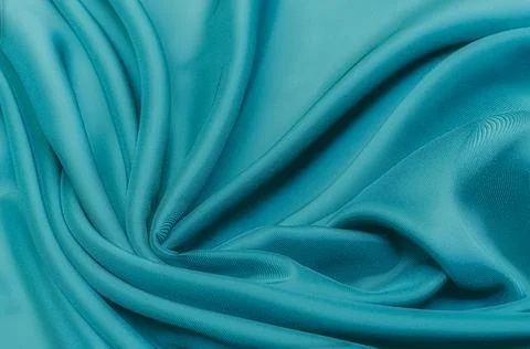 Texture, background, pattern. Texture of green silk fabric. Beautiful emerald Stock Photos