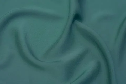 Texture, background, pattern. Texture of green silk fabric. Beautiful emerald Foto stock