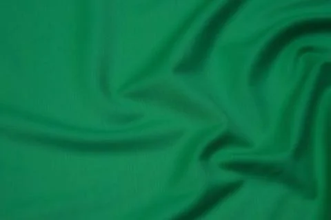 Texture, background, pattern. Texture of green silk fabric. Beautiful emerald Stock-Fotos