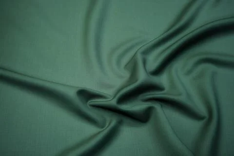 Texture, background, pattern. Texture of green silk fabric. Beautiful emerald Stock Photos