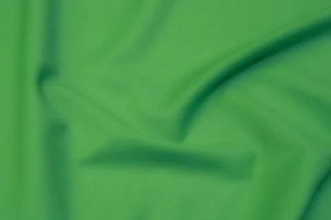 Texture, background, pattern. Texture of green silk fabric. Beautiful emerald Stock Photos