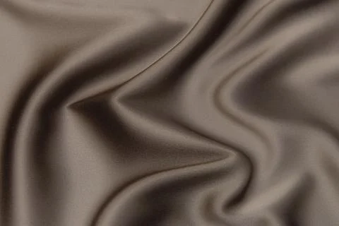 Texture, background, pattern. Texture of peach or beige silk or cotton fabric Stock Photos