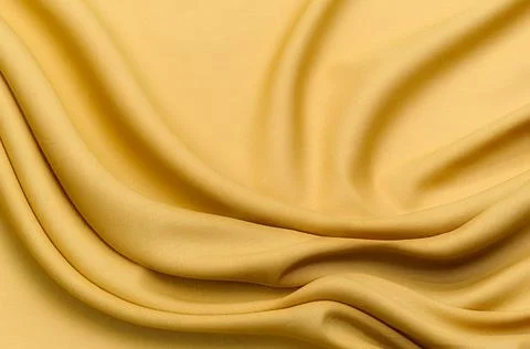 Texture, background, pattern. Texture of yellow or brown silk or cotton or wo Stock Photos