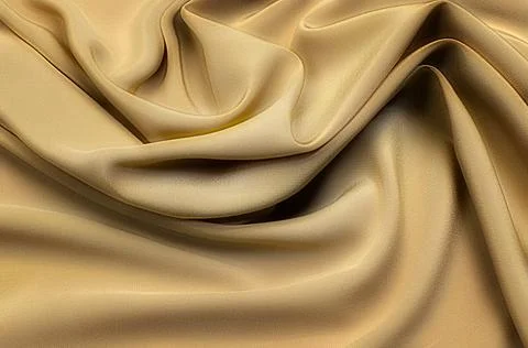 Texture, background, pattern. Texture of yellow or golden silk or cotton or w Stock Photos