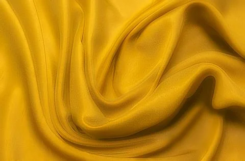 Texture, background, pattern. Texture of yellow or golden silk or cotton or w Stock Photos