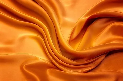 Texture, background, pattern. Texture of yellow or orange  silk or cotton or  Stock Photos