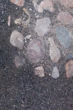 Texture, background. The pavement of granite stone. Old cobblestone road pave Stock Photos