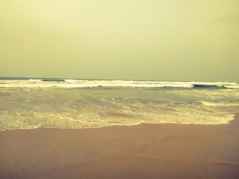 Texture background of sandy beach with gentle soft waves 스톡 사진