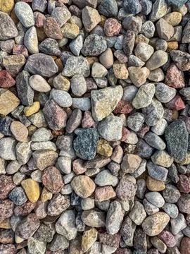 Texture background of small stones close-up, crushed stone, pebbles. Stock Photos