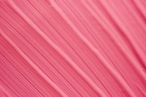 Texture background of smears of pink matte liquid lipstick or eye shadow Fotos de archivo