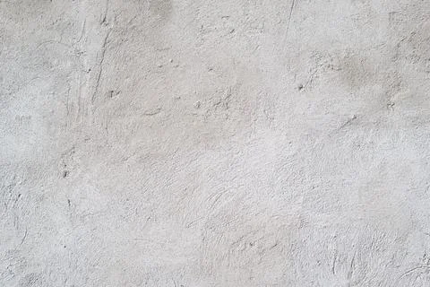 Texture background of uneven, rough concrete gray wall. Cement blank backdrop Stock Photos