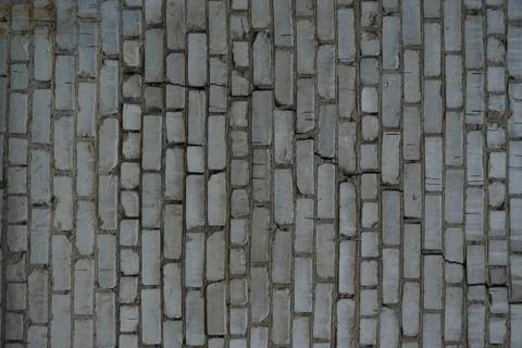 Texture, background wall light brick with a large crack Photos