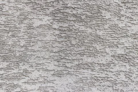Texture with a bark beetle pattern. Facing and plastering of buildings. Thin  Stock Photos