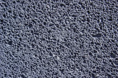 Texture, basalt, basalt wall, volcanic rock, stone with holes Stock Photos