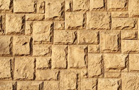 Texture of beautiful light brown stone wall as background Stock Photos