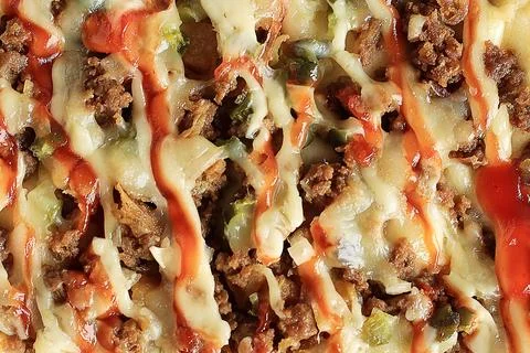 Texture of Beef Pizza with Paprika, Chilli Sauce, and Cheese Stock Photos