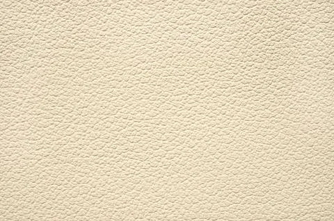The texture is beige artificial leather. Close-up. Foto stock