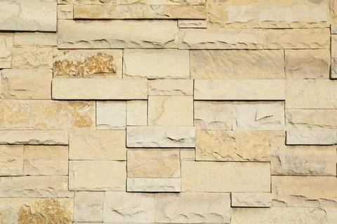 Texture of beige brick wall as background 库存照片