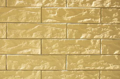 Texture of a beige brick wall. Close-up. Stock Photos