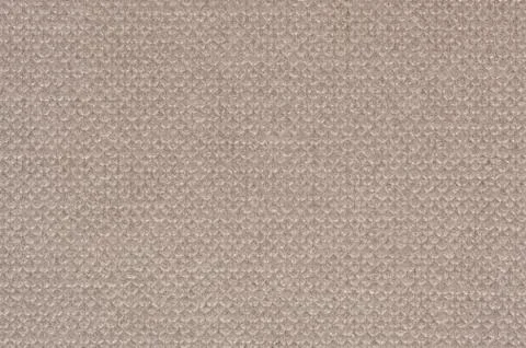 The texture of a beige cardboard box with a squeezed pattern in the form of Foto stock