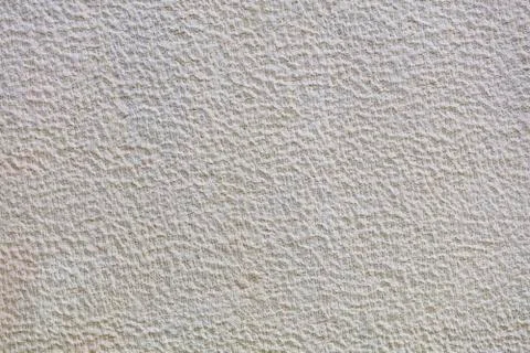 Texture of beige plaster on the wall Stock Photos