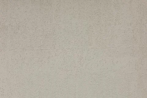 Texture of beige plaster wall. Rough surface bark beetle Stock Photos