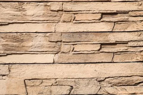 Texture of beige stone wall as background Stock Photos