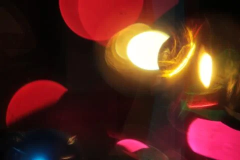 Texture of big colorful bokeh lights on black background juxtaposing Stock Photos