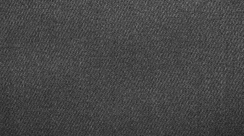 The texture of a black dense fluted fabric. Stock Photos