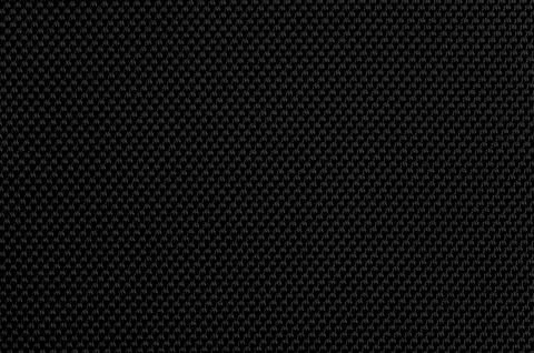 Texture of black fabric with a detailed pattern seen in close up during day.. Stock Photos