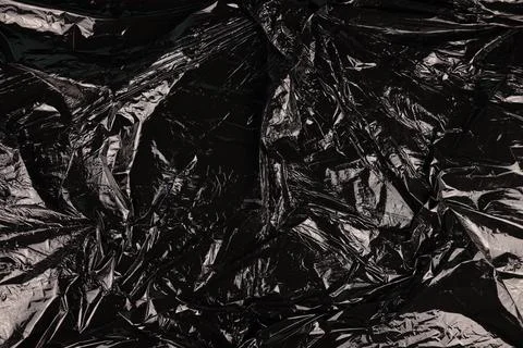 Texture of black plastic garbage disposable bag Stock Photos