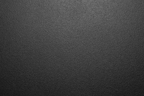 The texture of black rough plastic.Plastic matte background. Stock Photos