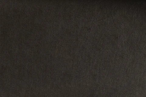 Texture of black spunbond. Close-up of black biodegradable polypropylene Stock Photos