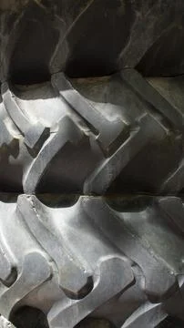 Texture of black stacked tractor wheels Stock Photos