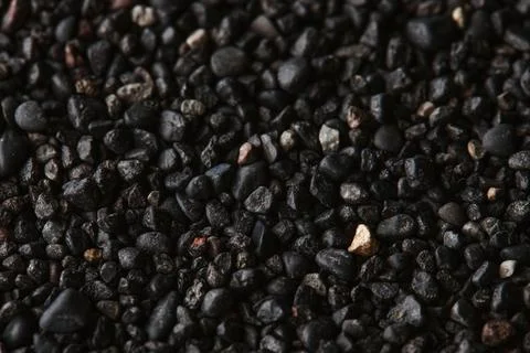 Texture of black volcanic sand for background. Black Sand beach macro 스톡 사진