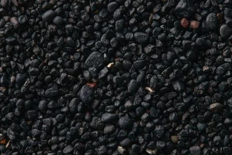 Texture of black volcanic sand for background. Black Sand beach macro 스톡 사진