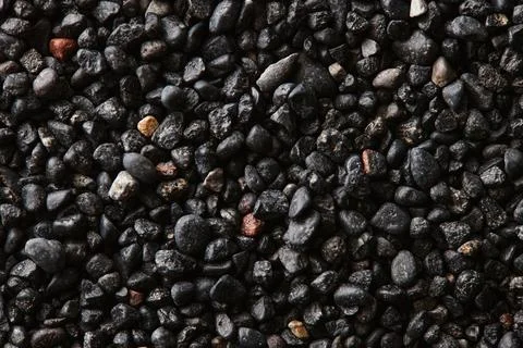 Texture of black volcanic sand for background. Black Sand beach macro 스톡 사진