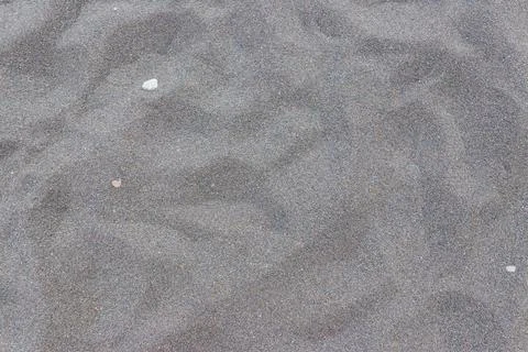 Texture of black volcanic sand for background Stock Photos