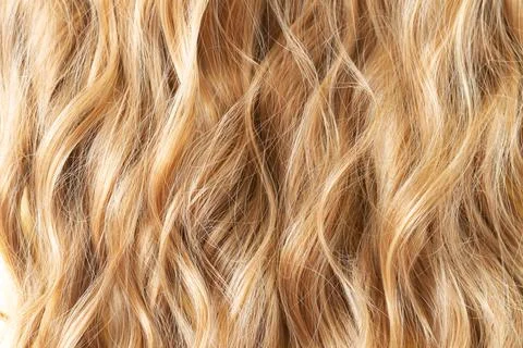Texture blond wavy hair cut styling care or extension concept Stock Photos
