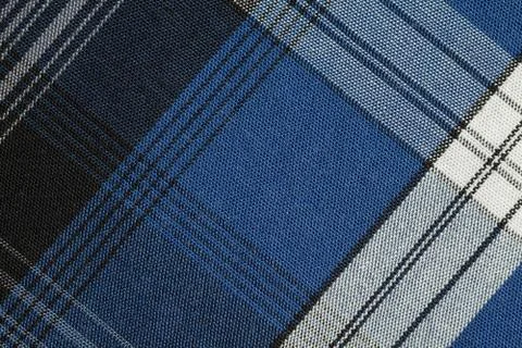 Texture of blue checkered fabric. Stock Photos