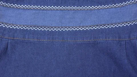 Texture of blue denim jeans with strings and stitching Stock Photos