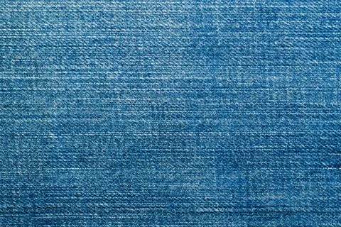 Texture of blue denim material close up, background Stock Photos